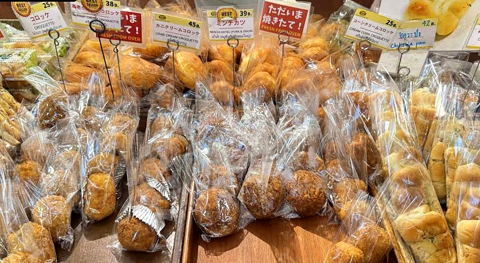 Packaged breads and rolls, tagged and ready — Custard Nakamura, Japanese bakery Bangkok