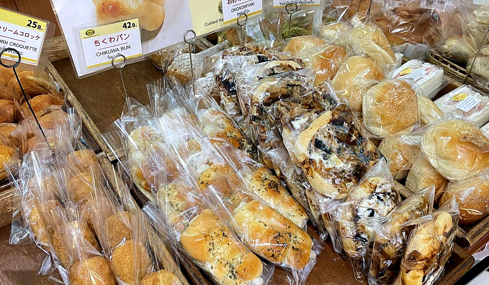 Chocolate and cream buns on the wooden shelf — Custard Nakamura, Japanese bakery Bangkok